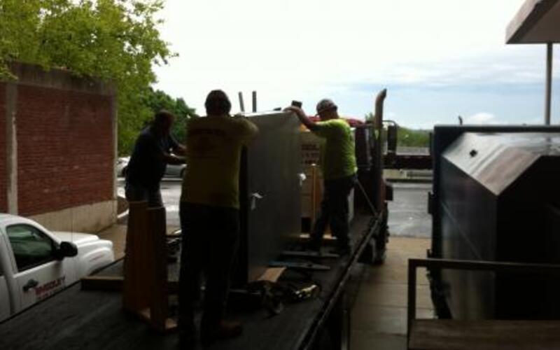 Loading the laser tables on the flat bed.