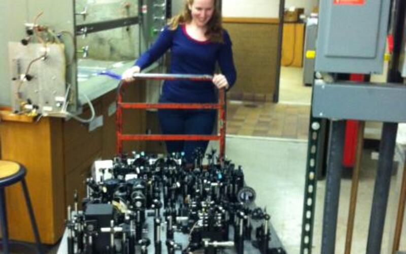 Becky wheeling all of the optics out of the old lab.